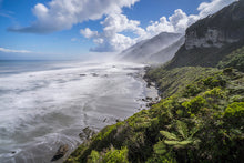 Load image into Gallery viewer, 12 Mile Coast Road between Greymouth and Punakaiki, with native West Coast bush meeting the Tasman Sea