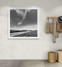 Load image into Gallery viewer, Framed Open Road Signs black and white landscape print displayed in a neutral contemporary interior.