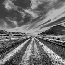 Load image into Gallery viewer, Long Straight, black and white photograph by Stewart Nimmo  of Lake Clearwater Road stretching towards the mountains in the Canterbury high country, New Zealand.