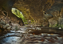 Load image into Gallery viewer, Oparara Arches and whiskey-coloured Oparara River near Karamea on the West Coast of New Zealand