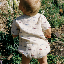Load image into Gallery viewer, baby wearing Monty suit from nature baby in the muslin row boat print