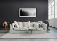 Load image into Gallery viewer, Arnold River Lake Brunner black and white fine art print by Stewart Nimmo framed above a sofa