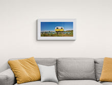 Load image into Gallery viewer, Whitebaiting Caravan Turnbull River fine art print by Stewart Nimmo framed above a sofa