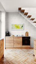 Load image into Gallery viewer, Framed Clematis fine art print by Stewart Nimmo displayed in a light modern kitchen interior.