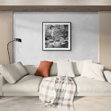 Load image into Gallery viewer, Clinton River black and white fine art print by Stewart Nimmo displayed above a bed in a neutral bedroom.