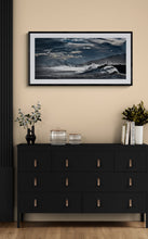 Load image into Gallery viewer, Framed Stormy Cobden Breakwater seascape photograph displayed in a darker interior with black frame