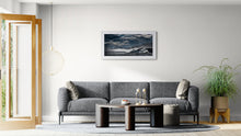 Load image into Gallery viewer, Stormy Cobden Breakwater West Coast landscape photograph framed in white, in a light modern interior 