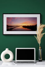 Load image into Gallery viewer, Sunset reflected in the Grey River at Greymouth, West Coast New Zealand framed on a green wall