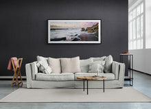 Load image into Gallery viewer, Framed North Beach Cobden West Coast landscape photograph by Stewart Nimmo displayed above a sofa in a dark room