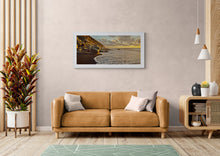 Load image into Gallery viewer, Warm evening light over rocks and waves Photographed by Stewart Nimmo at North Beach Cobden, West Coast New Zealand framed in white in modern interior