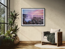 Load image into Gallery viewer, Framed Punakaiki Blowholes Sunset fine art print displayed in a sunlit room with an armchair and indoor plants