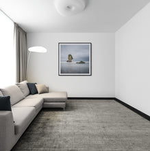 Load image into Gallery viewer, Two Rocks Punakaiki landscape print by Stewart Nimmo displayed framed in black in a living room