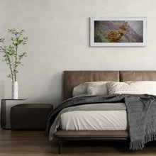 Load image into Gallery viewer, Rātā at Barrytown panoramic West Coast landscape print displayed above a bed