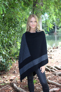 Asymmetrical possum merino poncho with geometric pattern in contrast colour. Textured knit structure feature in contrast panel. Lothlorian. Made in New Zealand. Charcoal