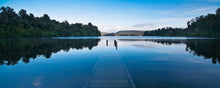 Load image into Gallery viewer, Lake Mapourika after heavy rain with the jetty submerged beneath the water, South Westland New Zealand