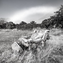 Load image into Gallery viewer, Black and white landscape photograph of an abandoned chair at Lake Pearson, Canterbury, New Zealand