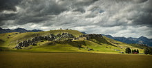 Load image into Gallery viewer, Castle Hill landscape in Canterbury with green farmland, limestone rock formations and dramatic clouds, photographed by Stewart Nimmo
