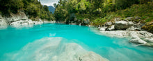 Load image into Gallery viewer, Turquoise water flowing through Hokitika Gorge surrounded by native forest on the West Coast of New Zealand