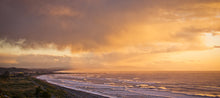 Load image into Gallery viewer, Evening light over Greymouth from North Beach Cobden, West Coast New Zealand, photographed by Stewart Nimmo