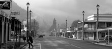 Load image into Gallery viewer, Black and white early morning photograph of Broadway in Reefton, West Coast New Zealand, by Stewart Nimmo